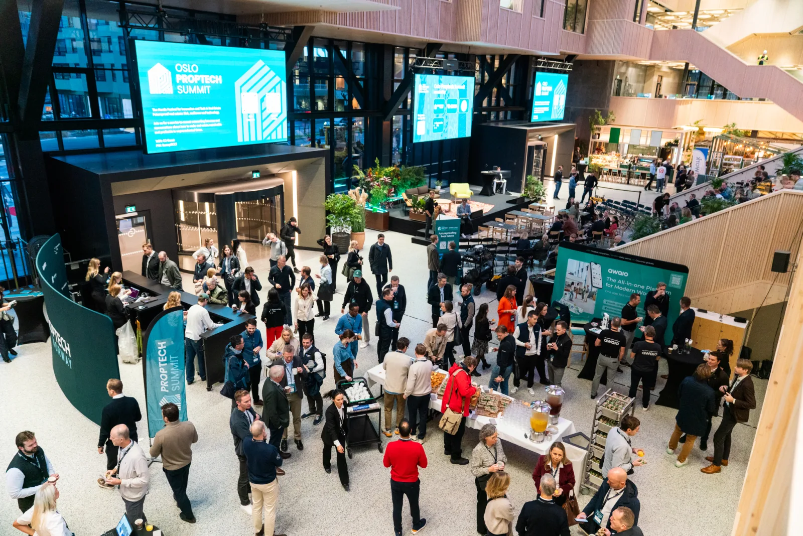 The Construction City atrium at Oslo Proptech Summit 2025, with the Awaio stand in the entrance hall