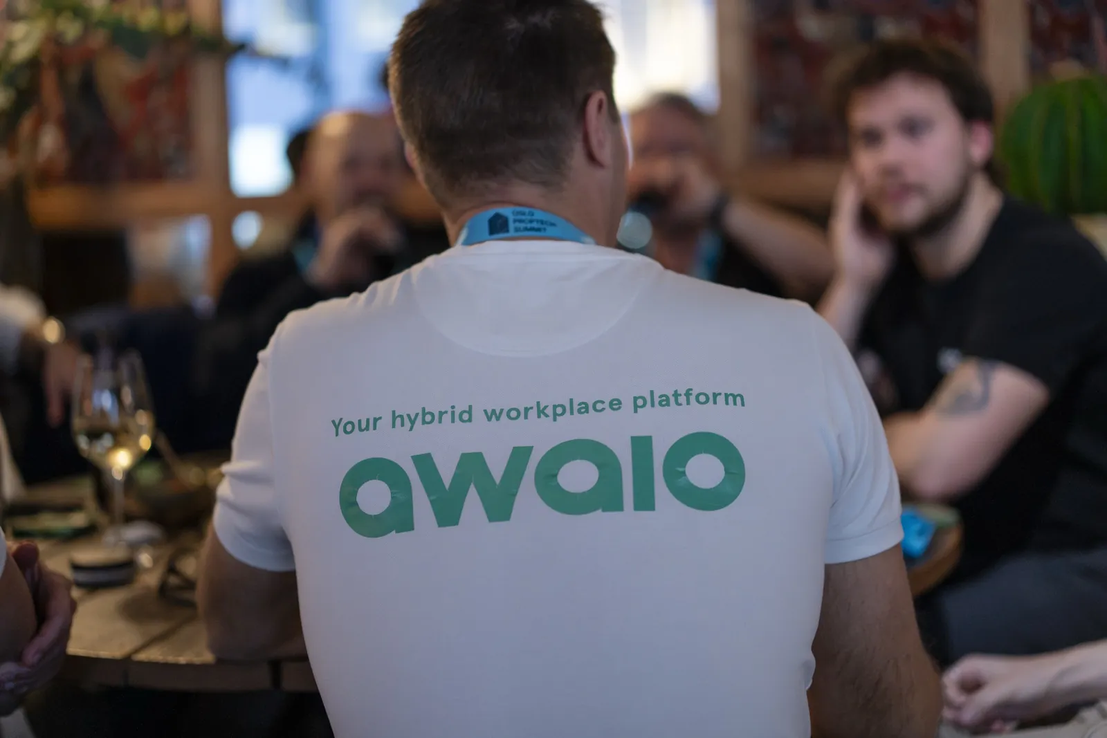 An Awaio team member in an Awaio t-shirt at the evening mingle