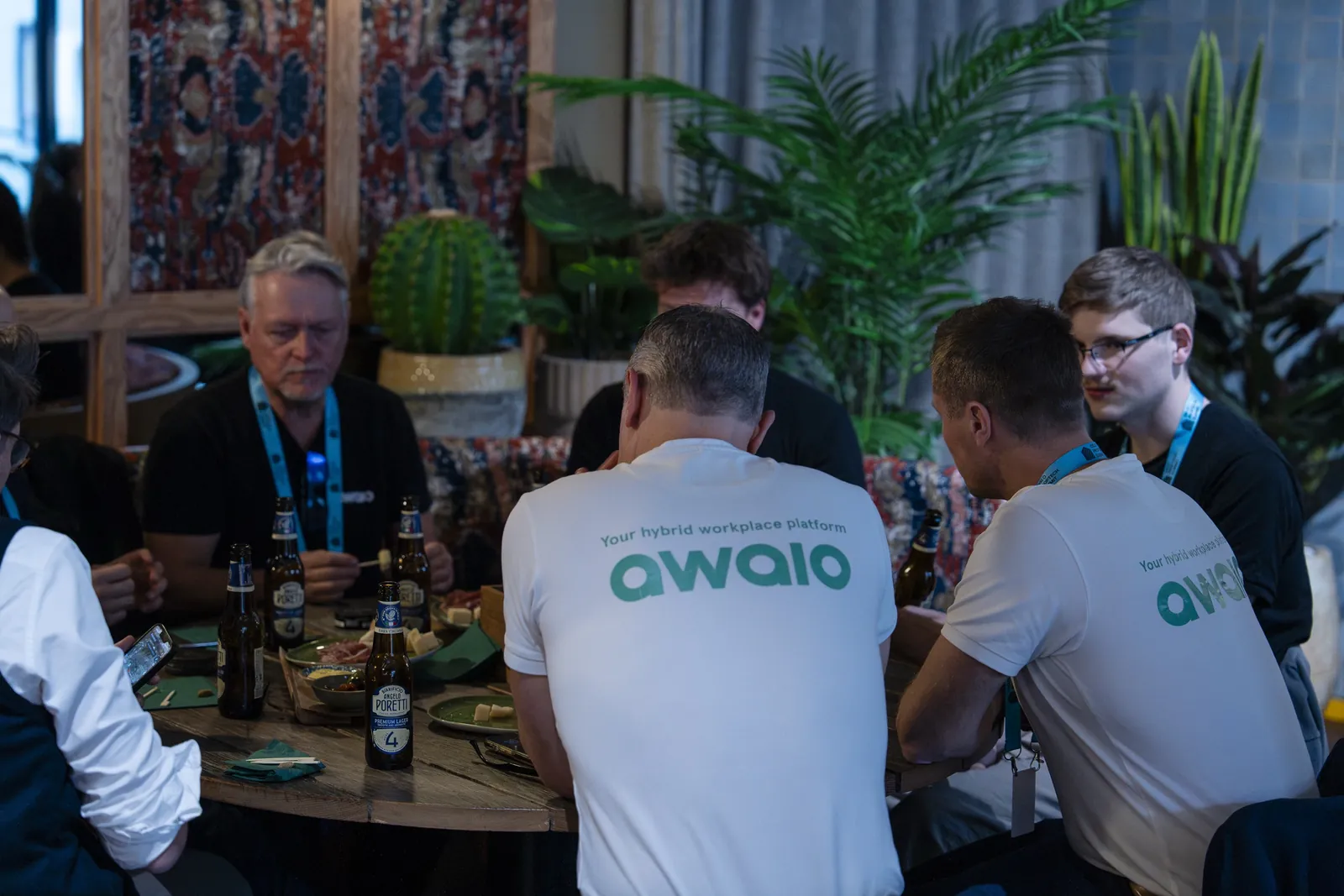 The Awaio team talking with guests around a table at the Oslo Proptech Summit 2026 mingle