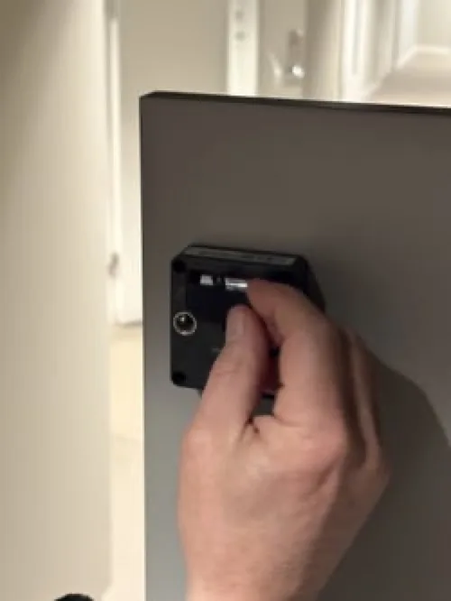 Remove the old battery from the compartment