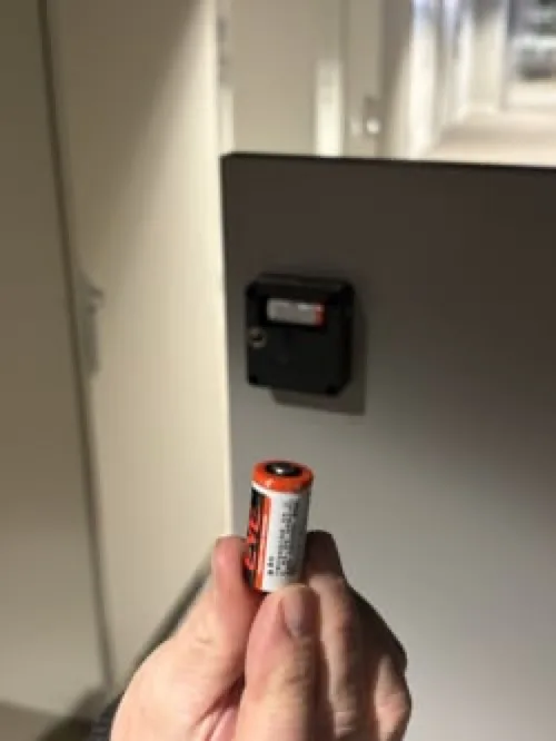 Insert the new CR123A battery