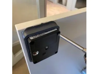 Step 9: place the lock into the template and fasten all four screws