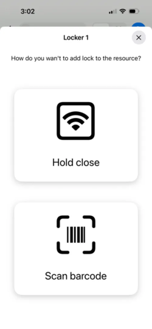 Hold your phone close to the lock to pair